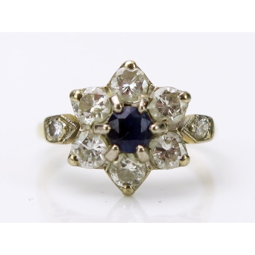 29 - Sapphire and Diamond Cluster Ring with millegrain set shoulders in an 18CT stamped gold setting, 17.... 