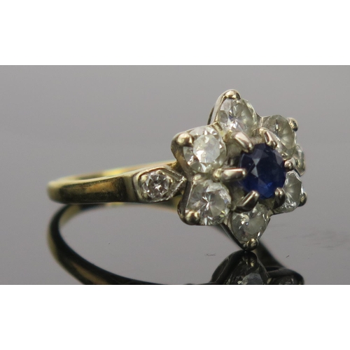 29 - Sapphire and Diamond Cluster Ring with millegrain set shoulders in an 18CT stamped gold setting, 17.... 