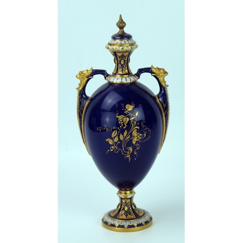 297 - Royal Worcester Fruit Vase and Cover of egg shape with two handles, decorated with apple and grapes,... 