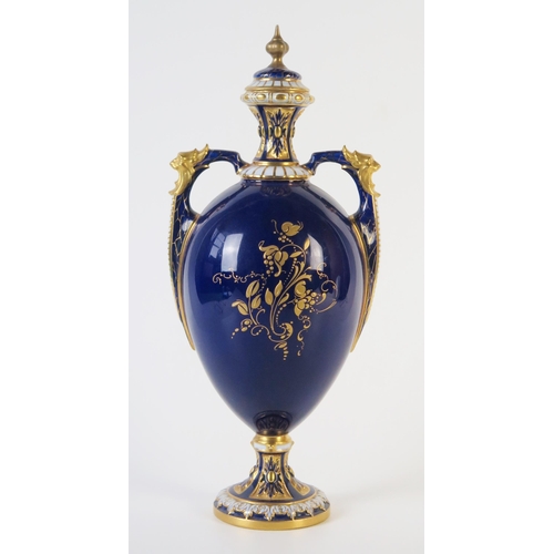 297 - Royal Worcester Fruit Vase and Cover of egg shape with two handles, decorated with apple and grapes,... 