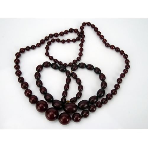 40 - Two Faux Cherry Amber Bead necklaces, one 29