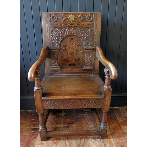 405 - 17th Century Style Oak Panel Back Armchair, carved Arcadian back inlaid central decoration, 59cm wid... 