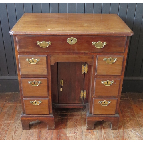 407 - George II Mahogany Kneehole Dressing Table the canted rectangular top above a long drawer, central c... 