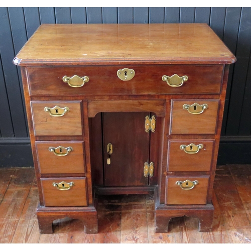 407 - George II Mahogany Kneehole Dressing Table the canted rectangular top above a long drawer, central c... 