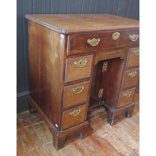 407 - George II Mahogany Kneehole Dressing Table the canted rectangular top above a long drawer, central c... 