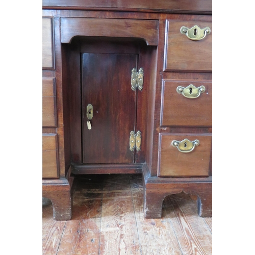 407 - George II Mahogany Kneehole Dressing Table the canted rectangular top above a long drawer, central c... 