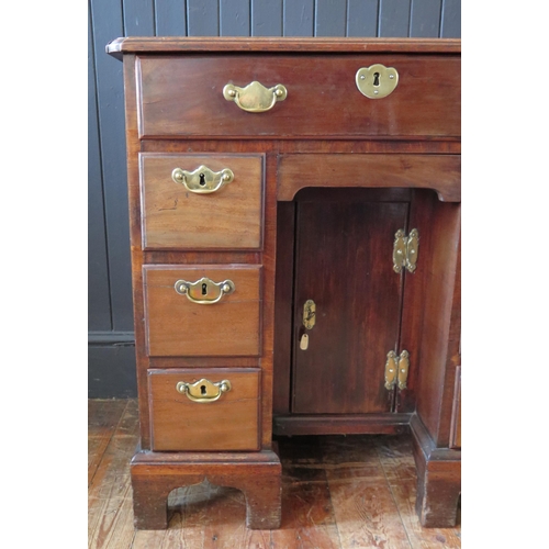 407 - George II Mahogany Kneehole Dressing Table the canted rectangular top above a long drawer, central c... 