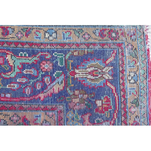 410 - A 20th Century Kashan style wool carpet, blue central medallion, red field, cream spandrels, blue bo... 