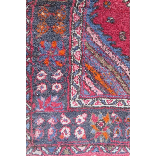 412 - A large 20th Century Turkish Runner, wool carpet, geometric diamond lozenges, red ground, pyramid gr... 