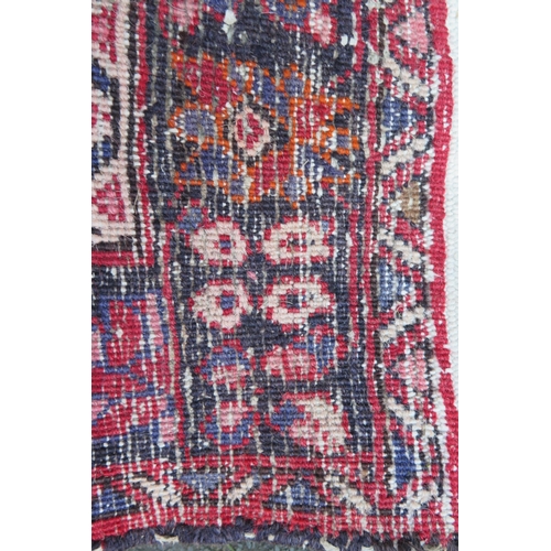 412 - A large 20th Century Turkish Runner, wool carpet, geometric diamond lozenges, red ground, pyramid gr... 