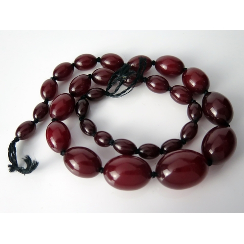 43 - Faux Cherry Amber Oval Bead Necklace, largest bead 29.5x21mm, 22.5