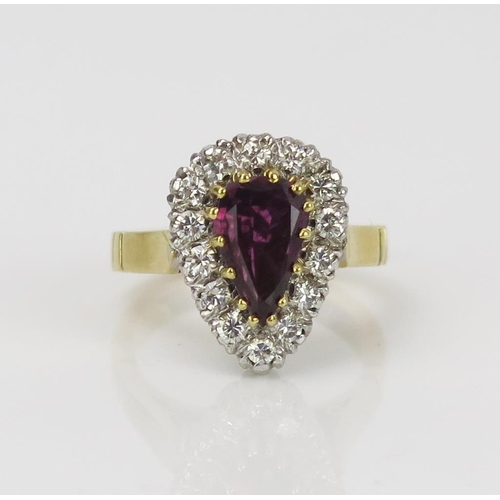 6 - Armandine Garnet? and Diamond Pear Shaped Ring in an unmarked high carat gold setting, 14.2x11mm hea... 