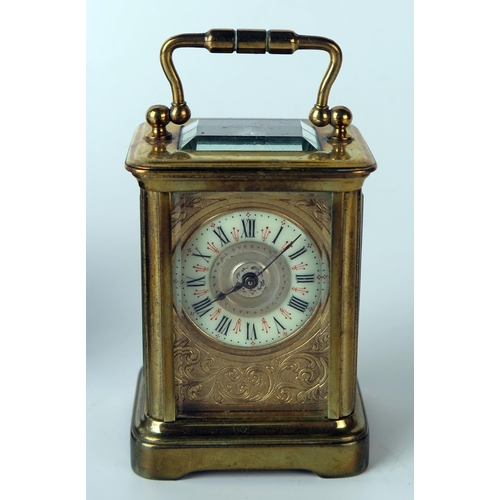 61 - A late 19th century brass miniature carriage timepiece, with 3.25cm Arabic dial, the movement with l... 