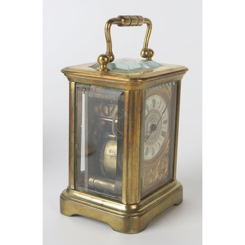 61 - A late 19th century brass miniature carriage timepiece, with 3.25cm Arabic dial, the movement with l... 