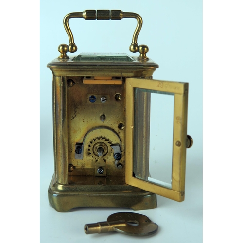 61 - A late 19th century brass miniature carriage timepiece, with 3.25cm Arabic dial, the movement with l... 