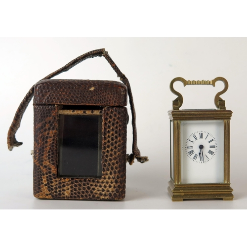 62 - A late 19th century French miniature brass carriage timepiece, with 3cm enamel Roman dial, the movem... 