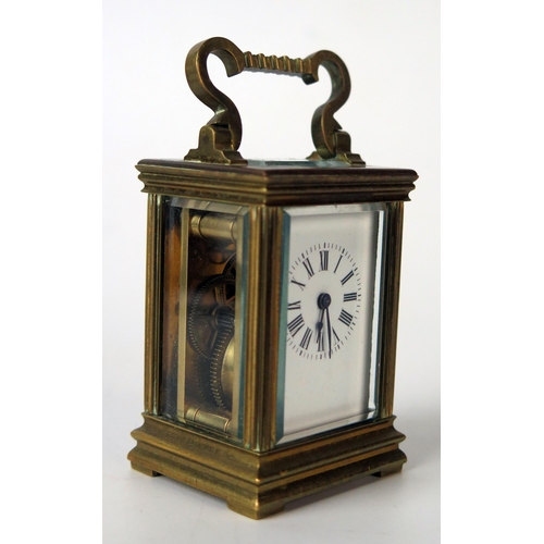 62 - A late 19th century French miniature brass carriage timepiece, with 3cm enamel Roman dial, the movem... 