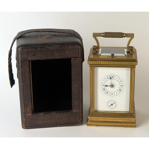 64 - A late 19th century French brass carriage clock, with 8cm Roman dial with subsidiary alarm dial, the... 