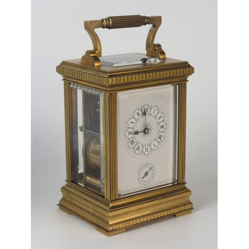 64 - A late 19th century French brass carriage clock, with 8cm Roman dial with subsidiary alarm dial, the... 