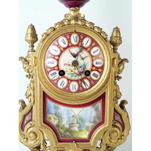 66 - A late 19th century French gilt metal an porcelain mounted mantel clock of arched outline, with urn ... 