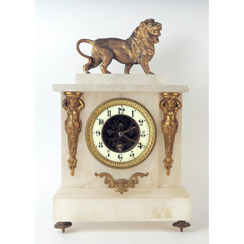 67 - A late 19th century alabaster and gilt metal mounted mantel timepiece, of rectangular outline, surmo... 