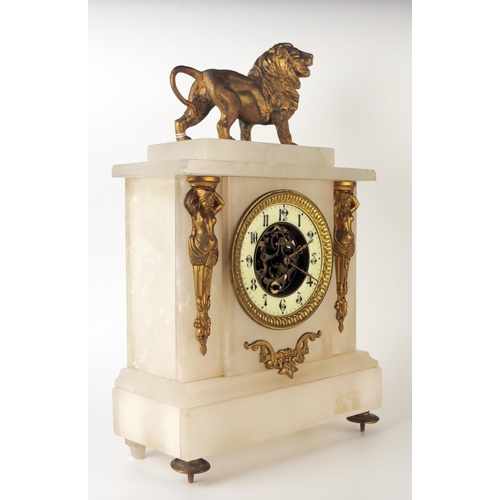 67 - A late 19th century alabaster and gilt metal mounted mantel timepiece, of rectangular outline, surmo... 