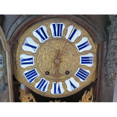 73 - A 19th century French mantel clock, of rectangular outline, decorated with caryatids and flaming urn... 