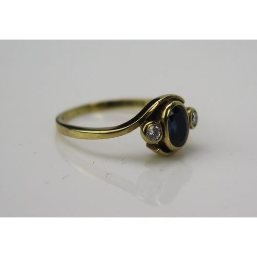 1008 - A late 20th Century sapphire and diamond ring, the central oval stone approximately 2mm, flanked by ... 