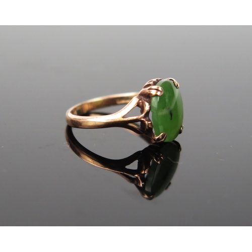 1036 - A 9ct Gold and Jadeite ring, 1.6g total, ring size approximately H.