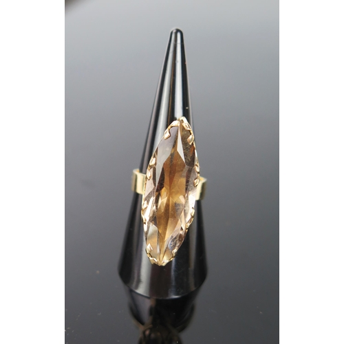 1041 - A 9ct Gold and Smoky Quartz Cocktail Ring, stone 32x10mm, 10.6g total, ring size O.