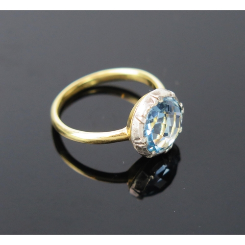 1045 - An Aquamarine and Yellow Metal Solitaire Ring, probably 9ct unmarked, in a white metal claw mount, 7... 