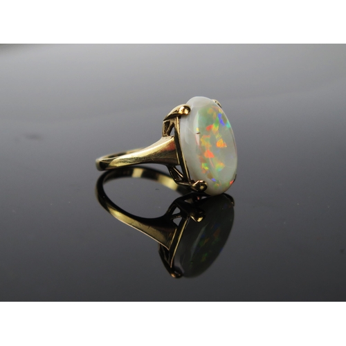 1049 - An Opal and 9ct Gold Ring, the doublet stone 17mm long, stamped 9.375, 4.0g total, ring size approxi... 