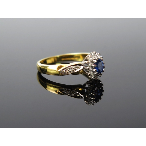 1051 - A Sapphire, Diamond and 18ct gold ring, central stone approximately 5mm, 5.2g total, ring size appro... 