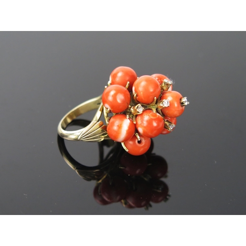 1052 - A Coral, Diamond and 14ct Gold Cocktail Ring, stamped 14ct, 17.1g total, ring size approximately J.