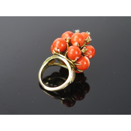 1052 - A Coral, Diamond and 14ct Gold Cocktail Ring, stamped 14ct, 17.1g total, ring size approximately J.