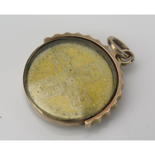 1080 - An Antique Gold Swivel Fob with a George II coin gilt behind glass, unmarked gold case, 8.8 g total.