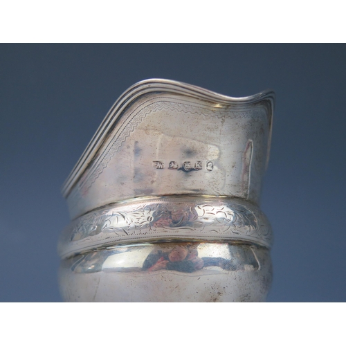 1123 - A George III silver cream jug, maker's mark worn, London, 1805, initialled, of barge-shaped outline,... 