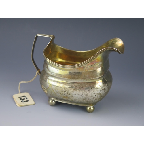 1127 - A George III silver cream jug, makers mark worn, London, 1809, of barge -shaped outline, with reeded... 