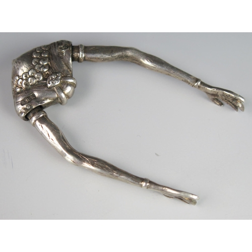 1168 - A George V silver novelty pair of sugar tongs, maker Berthold Muller, London, 1915, with grotesque m... 