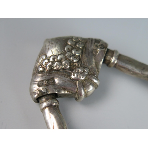 1168 - A George V silver novelty pair of sugar tongs, maker Berthold Muller, London, 1915, with grotesque m... 