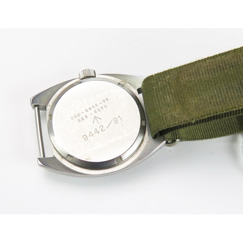 1250 - MWC British Military Wristwatch, the 35.5mm case back no. 6BB-6645-99 523-8290, military crows foot ... 