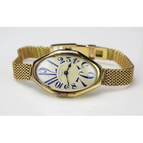 An Exceptional and Rare Patek Philippe 14ct gold wristwatch with oval dial having blue Arabic numerals, Serial No 181394 and PATEK PHILIPPE GÈNEVE stamped to back of case alongside gold marks. Inside of case with gold marks P.P.Co. Case c. 39x25mm, dial c. 34x20mm, on a chain link strap, 45.7g gross