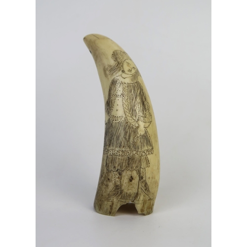 1423 - 19th Century Scrimshaw Whale's Tooth, decorated with a lady, prick and lamp black, c. 11cm long