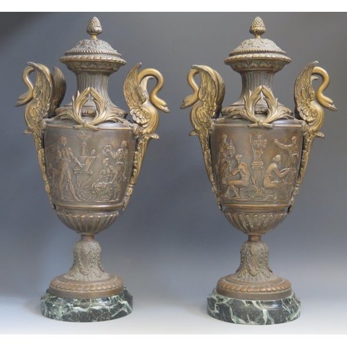 1655 - A pair of bronzed metal urns of neo-classical form, with pineapple finials, handles to the sides in ... 
