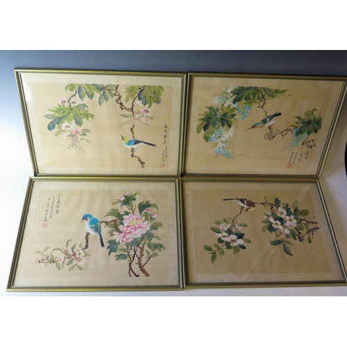 1673 - Four 20th Century Chinese paintings on silk, of birds on summer flowering shrubs, signed, 25x34.5cm.