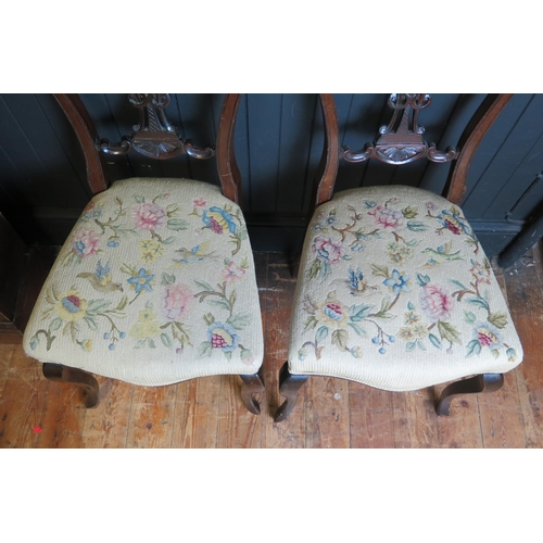 1685 - A pair of late Victorian salon chairs, with pierced and scroll backs, stuff-over seats raised on cab... 