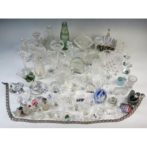 1870 - An extensive collection of assorted glass novelties, including paperweights, candlesticks, vases, ba... 