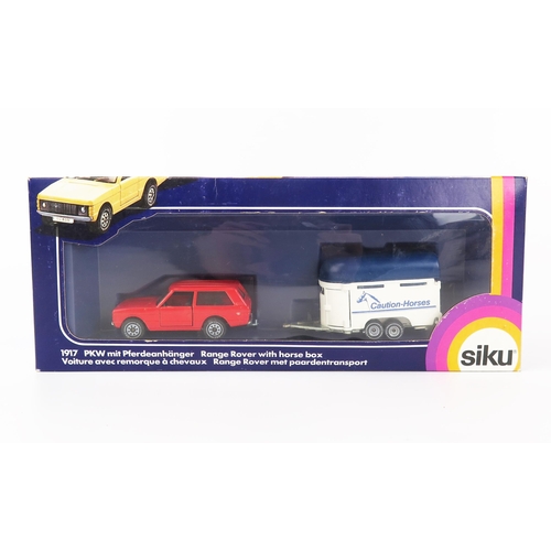 2423 - Siku 1917 Range Rover in red with horse box in white/blue 