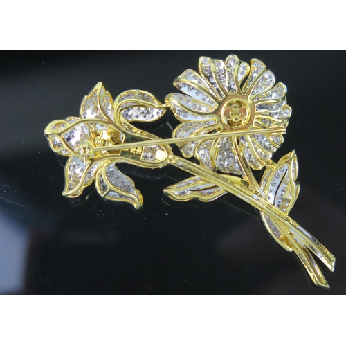 719 - A Modern White and Yellow Diamond Flower Brooch, the pistils set with yellow stones (largest 3.5mm) ... 