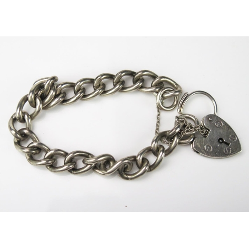 743 - A Silver Curb Link Gentleman's Bracelet, with padlock, Birmingham hallmark, 38g total.